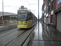 Tram 3060 calls at the Central stop, on Union Street in the centre of Oldham.  Photo J Dillon